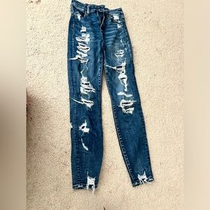 American eagle jeans, less holed pair is 0 regular, more holed pair is 00 long
